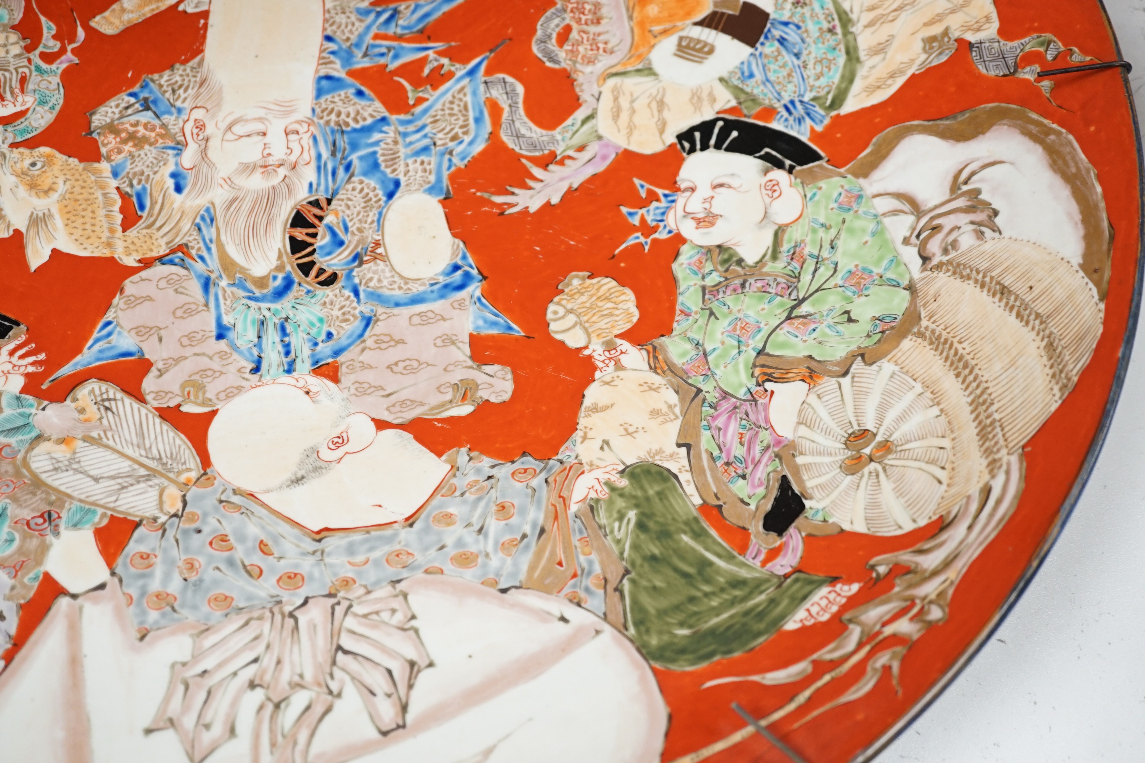 A massive Japanese Arita 'Seven Gods of Happiness' dish, Meiji period, 60.5cm.